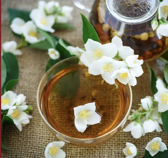 Chinese tea served with white blossoms